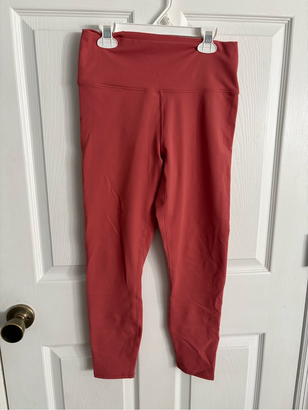 Fabletics High-Waist Leggings in Pink with cross cross back